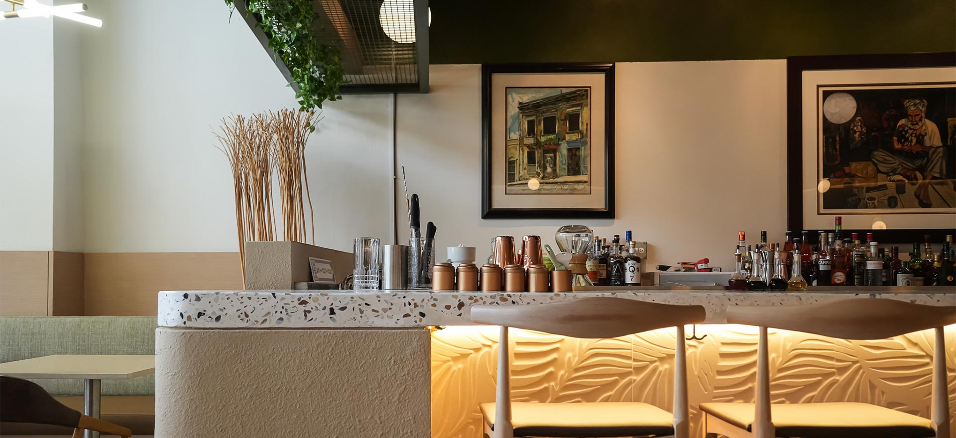 The bar at Identidad — stools and shelf